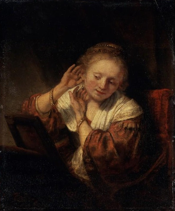 Jovem mulher experimentando brincos – Rembrandt van Rijn Rembrandt van Rijn Master Apollon